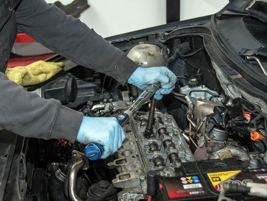 A mechanic working on a car