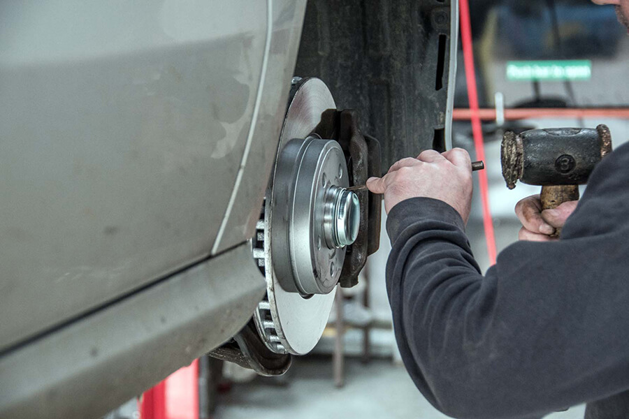 Mechanic working on a Brake Disc